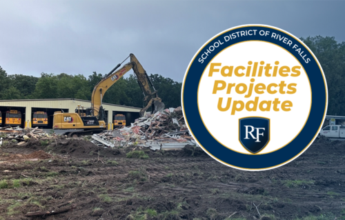 excavator demolishing a building